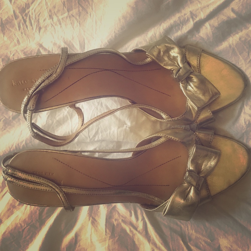 Kate Spade gold sling backs with bow.